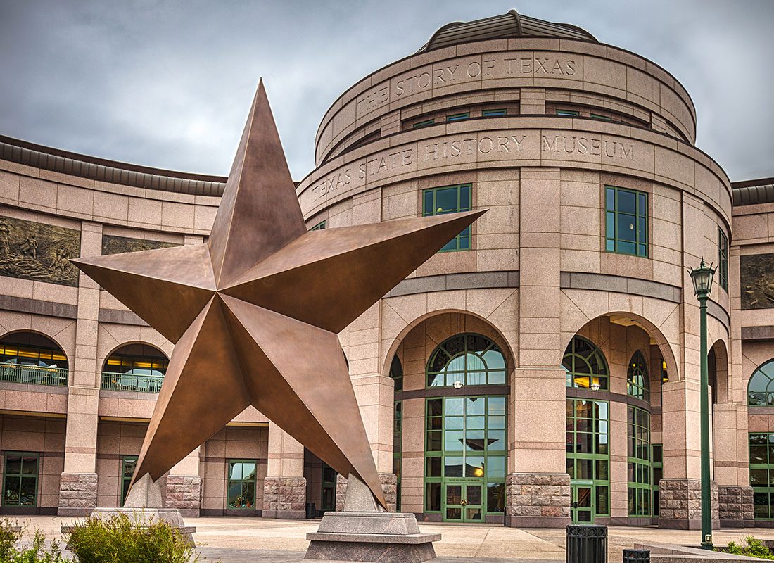 Existing Clients - View of Bullock Texas State Museum with a Large Star Statue in the Front in Austin Texas