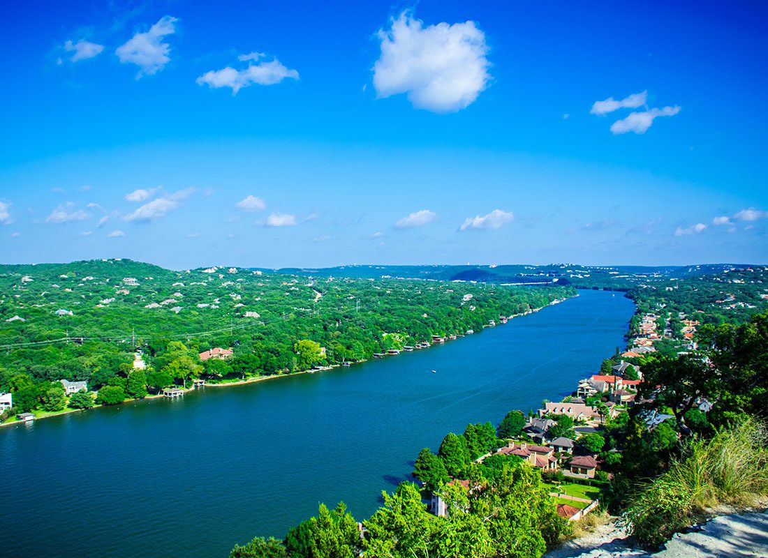 We Are Independent - Mount Bonnell Park in Austin Texas with Homes Surrounding the Lake on a Bright Summer Day